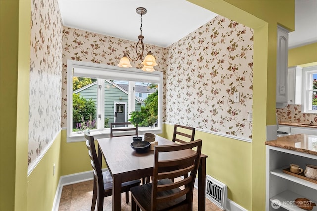 4116 N 39th St, Tacoma, WA 98407 - dining area with wallpapered walls, a chandelier, and plenty of natural light