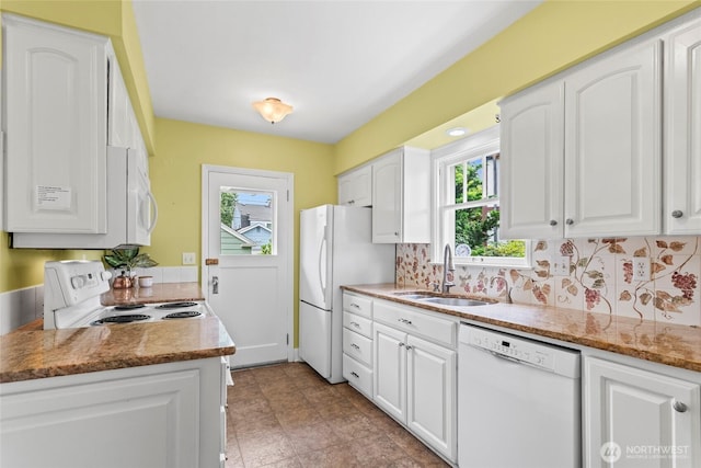 4116 N 39th St, Tacoma, WA 98407 - kitchen featuring white appliances, white cabinetry, backsplash, and light stone counters