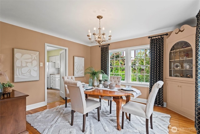 4116 N 39th St, Tacoma, WA 98407 - dining room with a chandelier and light wood-style flooring