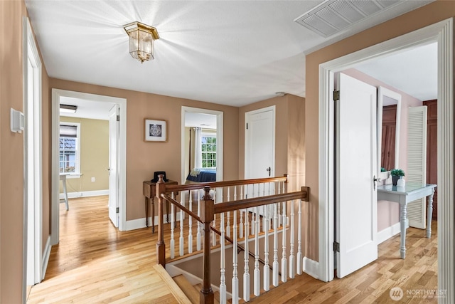 4116 N 39th St, Tacoma, WA 98407 - hall with an upstairs landing and light wood-type flooring