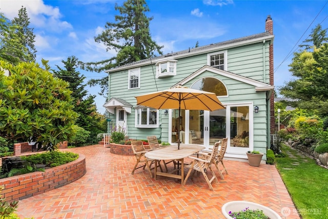 4116 N 39th St, Tacoma, WA 98407 - rear view of property featuring a patio and a chimney