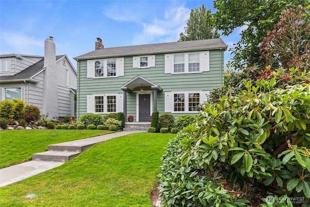 4116 N 39th St, Tacoma, WA 98407 - colonial house with a front yard and a chimney