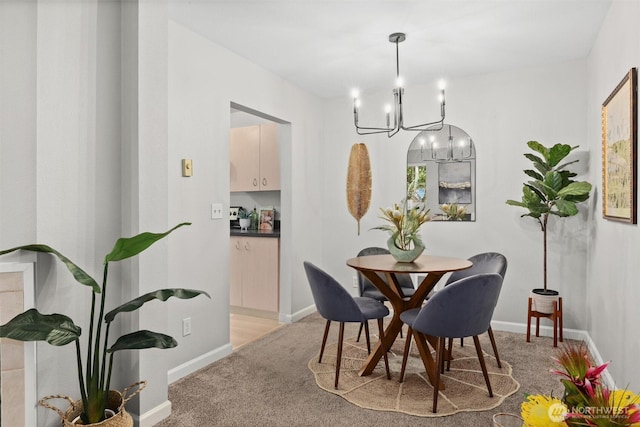 5300 Harbour Pointe Blvd Unit 311B, Mukilteo, WA 98275 - dining room featuring a chandelier and light carpet