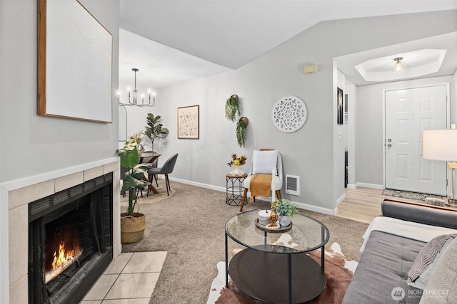 5300 Harbour Pointe Blvd Unit 311B, Mukilteo, WA 98275 - carpeted living room with a fireplace, a chandelier, and lofted ceiling