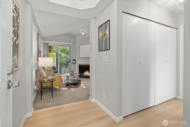 5300 Harbour Pointe Blvd Unit 311B, Mukilteo, WA 98275 - corridor featuring wood finished floors and vaulted ceiling