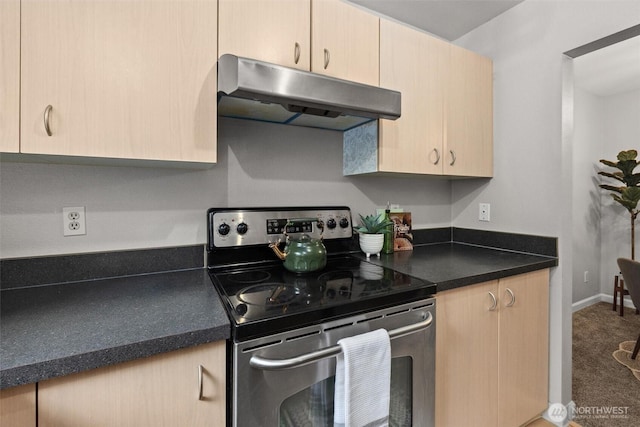 5300 Harbour Pointe Blvd Unit 311B, Mukilteo, WA 98275 - kitchen featuring stainless steel range with electric stovetop, under cabinet range hood, carpet, dark countertops, and light brown cabinetry