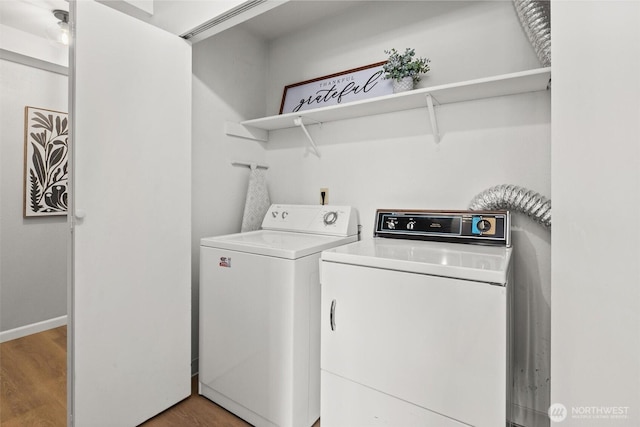 5300 Harbour Pointe Blvd Unit 311B, Mukilteo, WA 98275 - washroom featuring washer and dryer and light wood finished floors