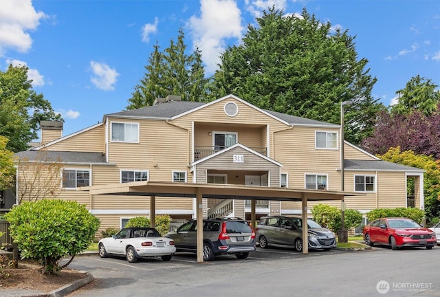 5300 Harbour Pointe Blvd Unit 311B, Mukilteo, WA 98275 - view of property featuring covered parking