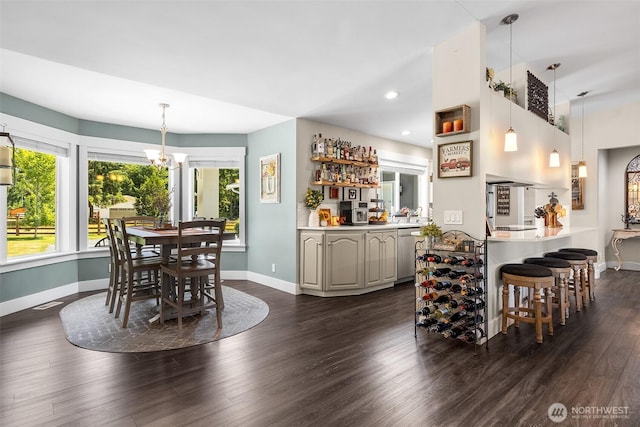 5810 246th St E, Graham, WA 98338 - dining area featuring a dry bar, dark wood-style flooring, plenty of natural light, and recessed lighting