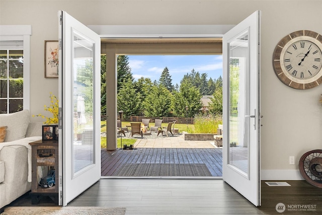 5810 246th St E, Graham, WA 98338 - doorway to outside featuring wood finished floors
