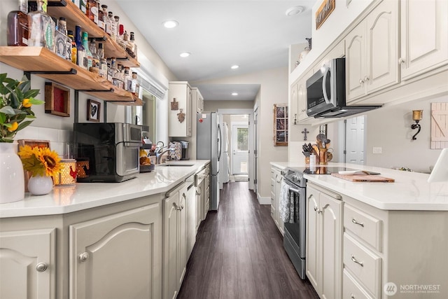5810 246th St E, Graham, WA 98338 - kitchen featuring appliances with stainless steel finishes, dark wood-style floors, recessed lighting, white cabinets, and light countertops