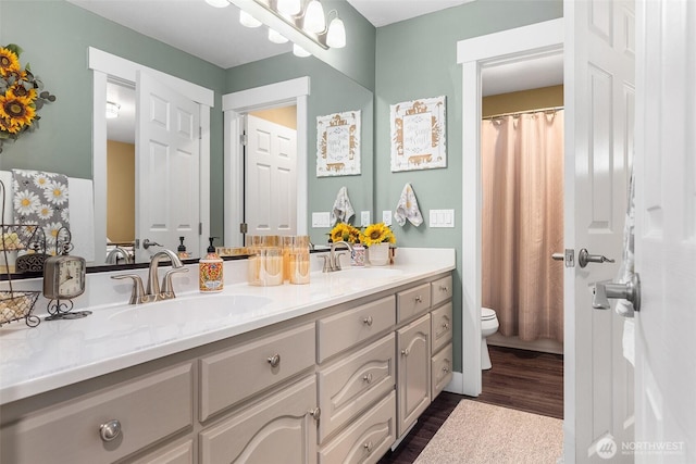 5810 246th St E, Graham, WA 98338 - bathroom with wood finished floors and double vanity