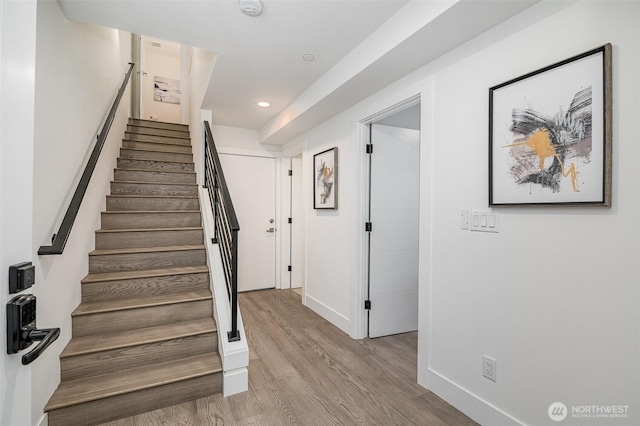 7731 NE 175th St Unit 102, Kenmore, WA 98028 - stairway with wood finished floors and recessed lighting