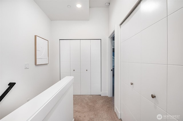 7731 NE 175th St Unit 102, Kenmore, WA 98028 - hallway featuring light colored carpet and recessed lighting