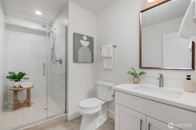 7731 NE 175th St Unit 102, Kenmore, WA 98028 - bathroom featuring vanity, a stall shower, tile patterned flooring, and recessed lighting