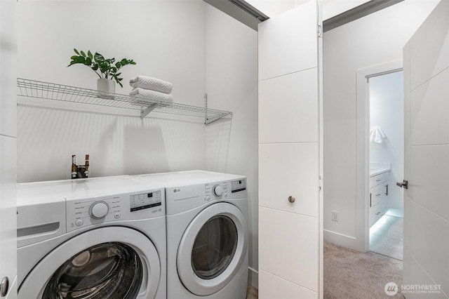 7731 NE 175th St Unit 102, Kenmore, WA 98028 - laundry area featuring washer and clothes dryer and light carpet