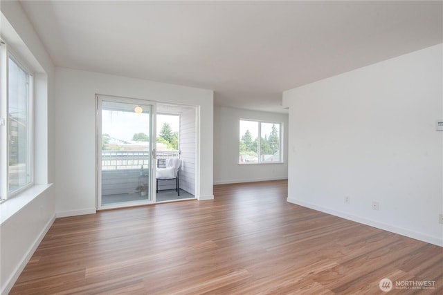 1000 NE 88th St Unit 303, Seattle, WA 98115 - unfurnished room featuring light wood-style flooring and baseboards