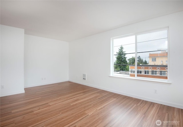 1000 NE 88th St Unit 303, Seattle, WA 98115 - empty room with wood finished floors and baseboards