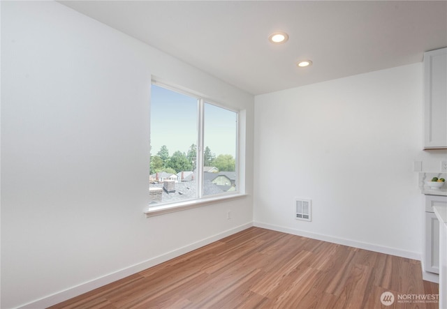 1000 NE 88th St Unit 303, Seattle, WA 98115 - unfurnished dining area featuring light wood-style floors and recessed lighting
