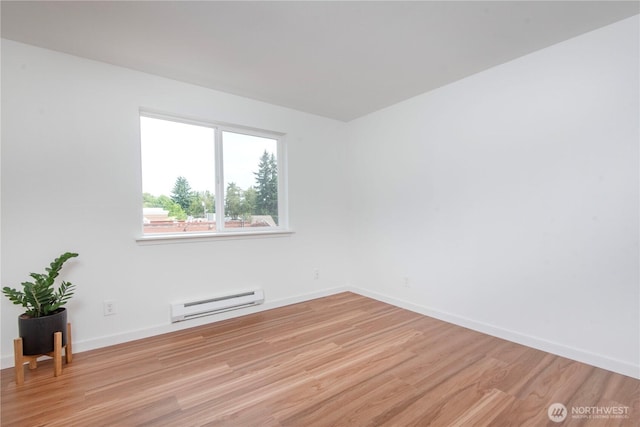 1000 NE 88th St Unit 303, Seattle, WA 98115 - empty room featuring baseboard heating and light wood-style flooring