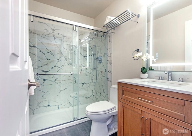 1000 NE 88th St Unit 303, Seattle, WA 98115 - bathroom with a marble finish shower, vanity, and wood finished floors