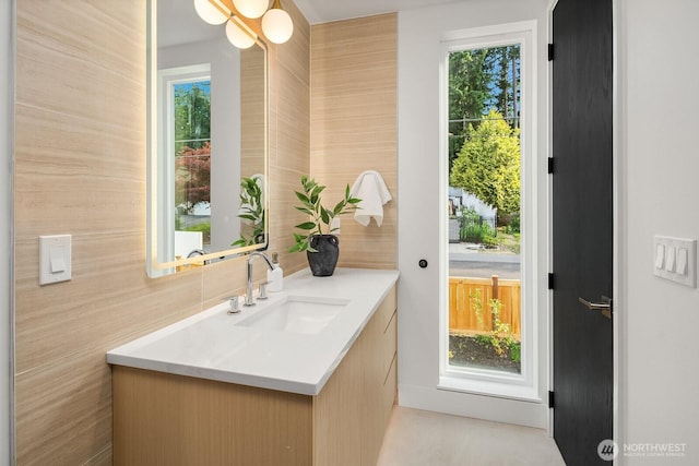 3983 162nd Pl SE, Bellevue, WA 98006 - bathroom with vanity, plenty of natural light, backsplash, and tile walls