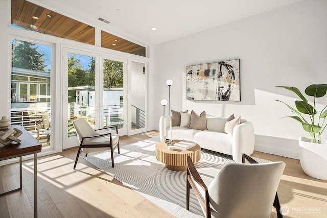 3983 162nd Pl SE, Bellevue, WA 98006 - living room featuring french doors, light wood-style floors, and recessed lighting