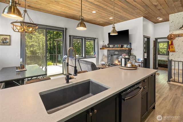 1712 Nelson Siding Rd, Cle Elum, WA 98922 - kitchen featuring wood ceiling, dishwasher, pendant lighting, a stone fireplace, and wood finished floors