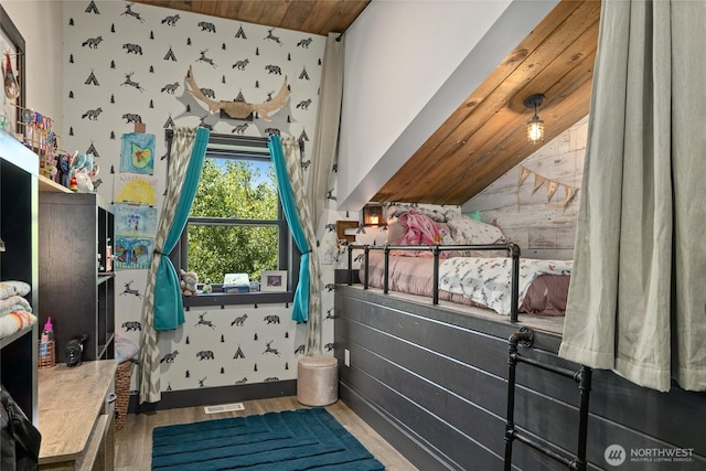 1712 Nelson Siding Rd, Cle Elum, WA 98922 - bedroom with wooden ceiling, vaulted ceiling, wood finished floors, and wallpapered walls