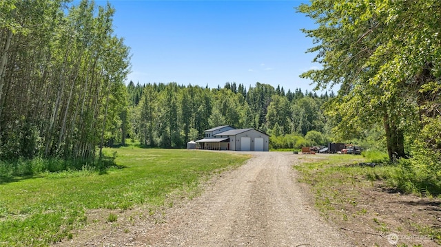 1712 Nelson Siding Rd, Cle Elum, WA 98922 - view of dirt / gravel road featuring a pole building and a view of trees