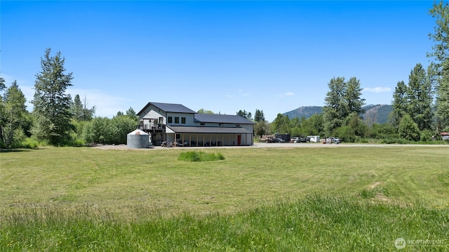 1712 Nelson Siding Rd, Cle Elum, WA 98922 - view of front of property with a front lawn and a mountain view