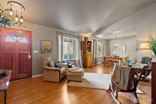 16325 Tareyton Ln SE, Yelm, WA 98597 - living area featuring a chandelier, wood finished floors, and lofted ceiling