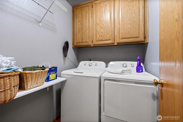16325 Tareyton Ln SE, Yelm, WA 98597 - washroom featuring separate washer and dryer and cabinet space