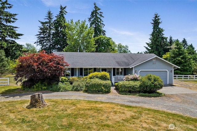 16325 Tareyton Ln SE, Yelm, WA 98597 - ranch-style home with concrete driveway and a garage