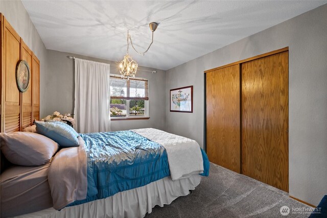 16325 Tareyton Ln SE, Yelm, WA 98597 - bedroom with carpet flooring, a chandelier, and a closet