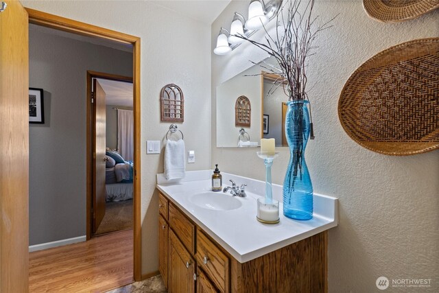 16325 Tareyton Ln SE, Yelm, WA 98597 - ensuite bathroom with vanity and wood finished floors