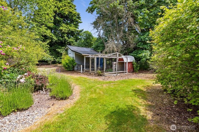16325 Tareyton Ln SE, Yelm, WA 98597 - view of grassy yard with exterior structure and an outbuilding