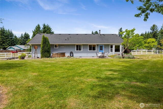 16325 Tareyton Ln SE, Yelm, WA 98597 - rear view of house featuring a hot tub, a fenced backyard, a patio area, and a shingled roof