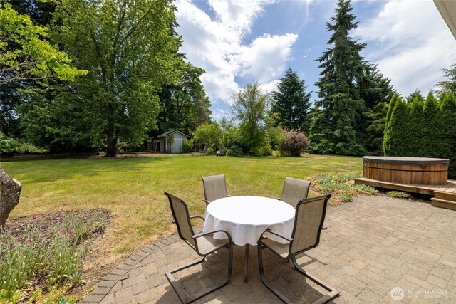 16325 Tareyton Ln SE, Yelm, WA 98597 - view of patio featuring a hot tub and an outbuilding