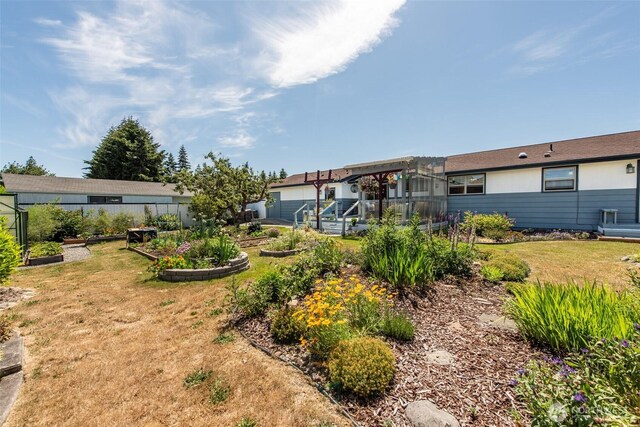 516 E Willow St, Sequim, WA 98382 - view of grassy yard featuring a vegetable garden