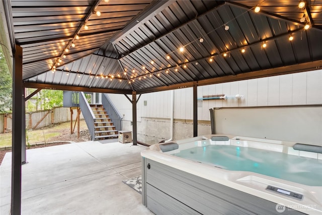 18401 Rampart Dr SE, Yelm, WA 98597 - view of patio with a hot tub, stairs, and a gazebo