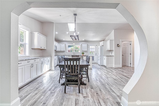 87 N Mary Ave, East Wenatchee, WA 98802 - dining area with light wood-type flooring and baseboards