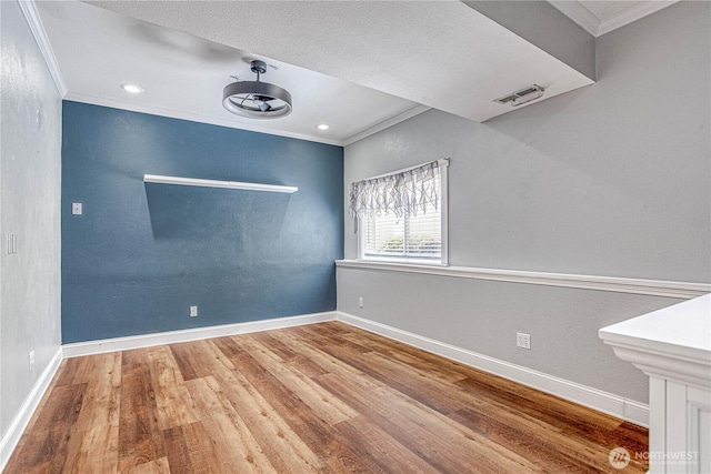 87 N Mary Ave, East Wenatchee, WA 98802 - unfurnished room featuring ornamental molding, wood finished floors, and a textured wall