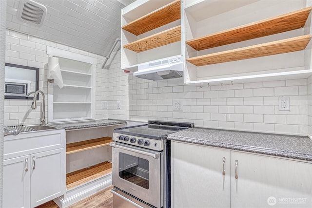 87 N Mary Ave, East Wenatchee, WA 98802 - kitchen with open shelves, stainless steel range with electric cooktop, under cabinet range hood, backsplash, and white cabinets