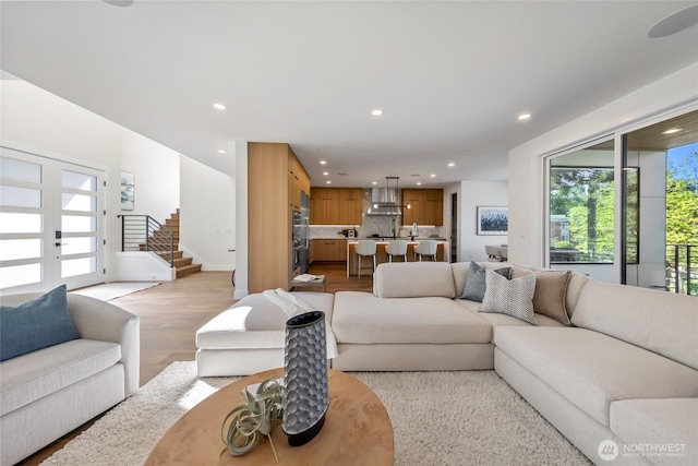 10204NE 43rd St, Kirkland, WA 98033 - living room with recessed lighting, light wood-type flooring, and stairway