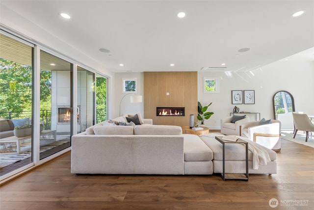 10204NE 43rd St, Kirkland, WA 98033 - living room featuring a large fireplace, recessed lighting, and wood finished floors