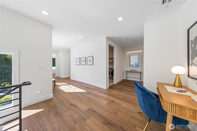 10204NE 43rd St, Kirkland, WA 98033 - hallway with washer / dryer, healthy amount of natural light, wood finished floors, recessed lighting, and a desk