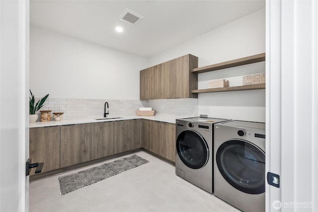 10204NE 43rd St, Kirkland, WA 98033 - washroom featuring washer and dryer, cabinet space, recessed lighting, and light floors