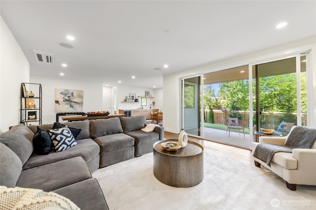 10204NE 43rd St, Kirkland, WA 98033 - living room featuring light wood-style floors and recessed lighting
