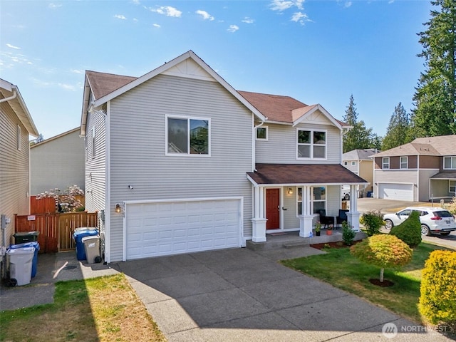 29709 217th Pl SE, Kent, WA 98042 - traditional-style home with an attached garage, covered porch, concrete driveway, and roof with shingles